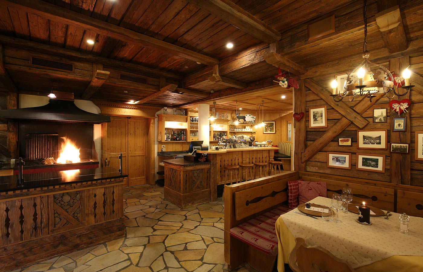 Interior of the restaurant Miky's Grill, entirely decorated in wood with oven on